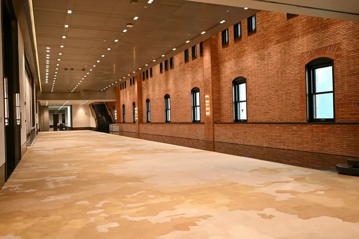 Empty exhibition hall with carpeted floor area for event flooring applications