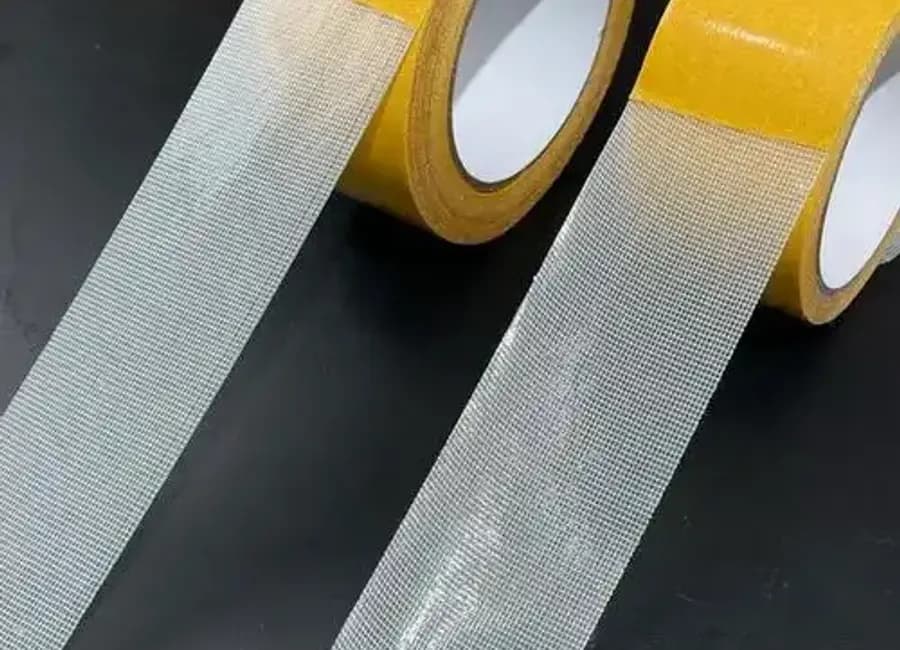 ScrimTack ST-300 double-sided cloth tape strips with cloth-yarn carrier visible
